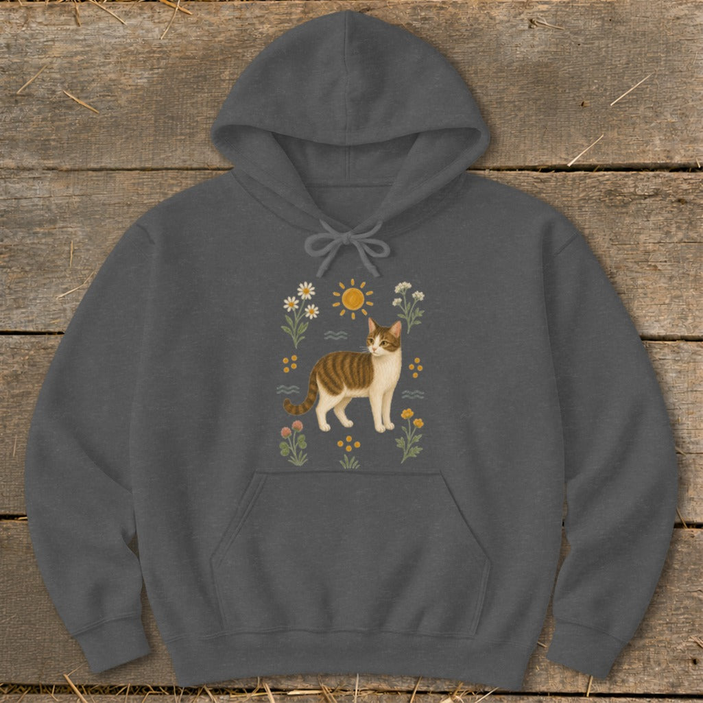 Dark gray hoodie with a brown and white cat illustration surrounded by flowers and sun.