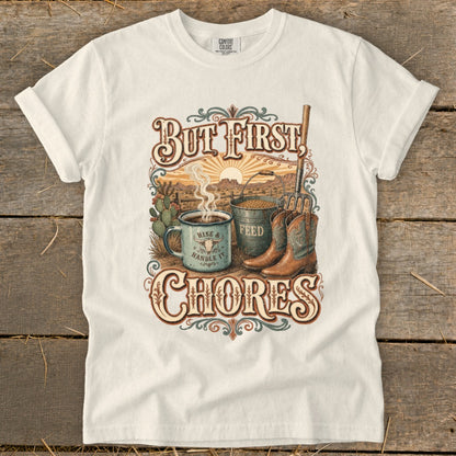 White t-shirt with "But First CHORES" text, coffee mug, feed bucket, and cowboy boots.