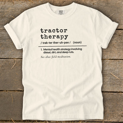 Cream Comfort Colors t-shirt with "tractor therapy" definition in black text.