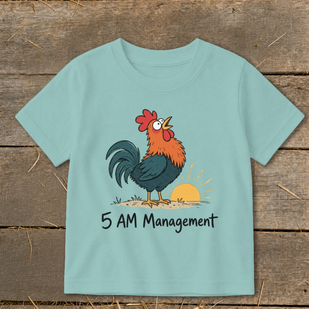 Light blue t-shirt with a cartoon rooster and sunrise, says "5 AM Management".
