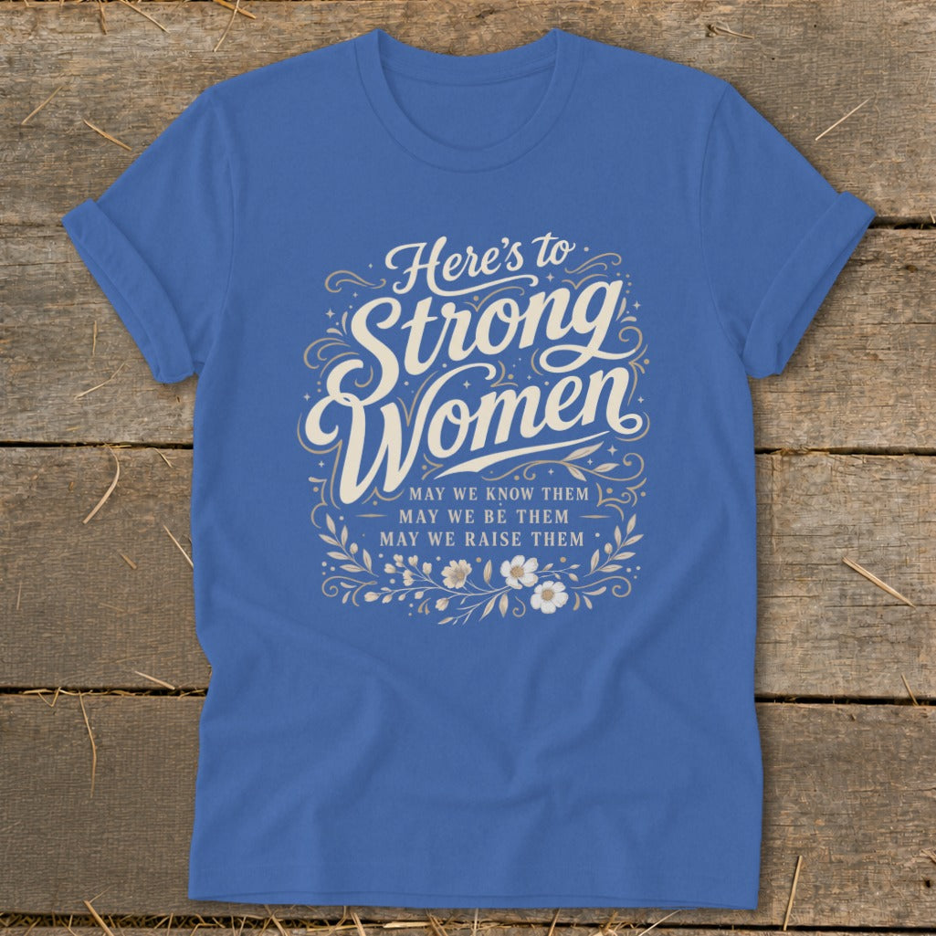 Blue t-shirt with "Here's to Strong Women" and floral design.