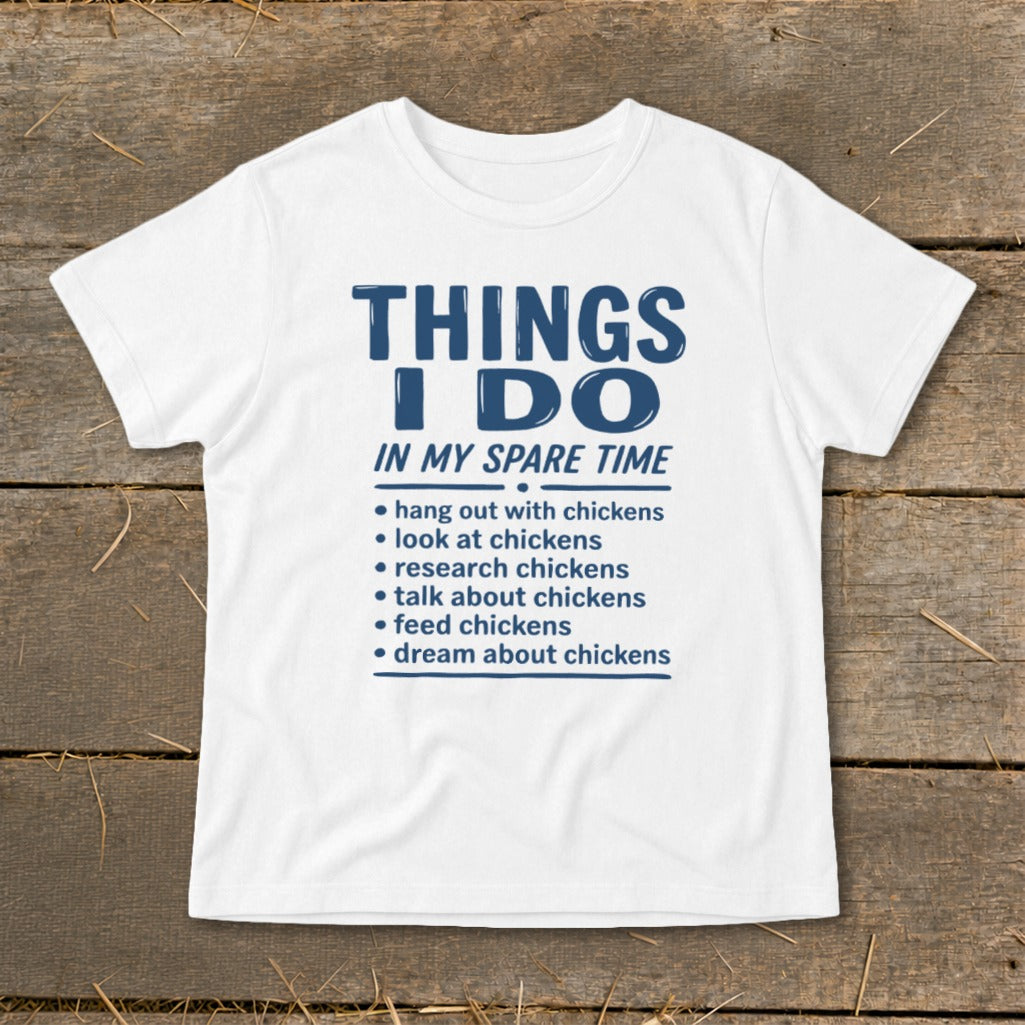 White t-shirt with blue text listing chicken-related activities in spare time.