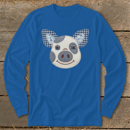 Blue long-sleeve shirt with a patchwork pig face applique and checkered ears.