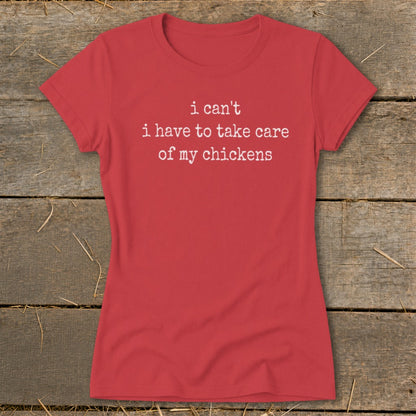 Red t-shirt with white text reading "i can't i have to take care of my chickens".