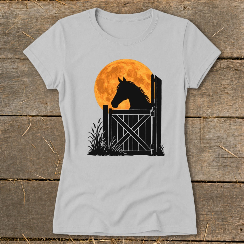 Light gray t-shirt featuring a graphic of a horse's silhouette behind a stable gate against a full orange moon.