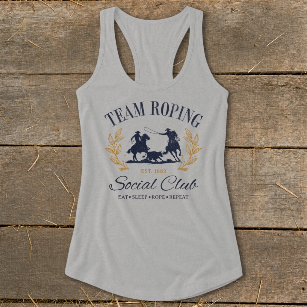 Light gray tank top with "Team Roping Social Club" graphic and rodeo imagery.