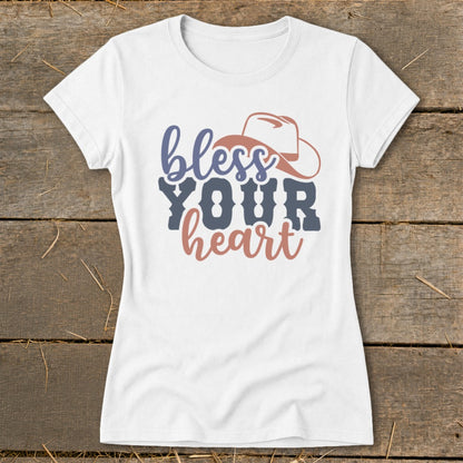 White t-shirt with "bless YOUR heart" and a cowboy hat graphic.