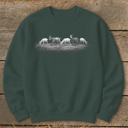 Crewneck sweatshirt with a black and white illustration of five goats grazing in a field.