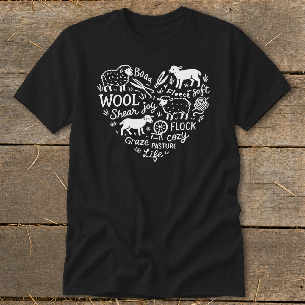 Black t-shirt with a white heart design featuring sheep, wool, and text about farm life.