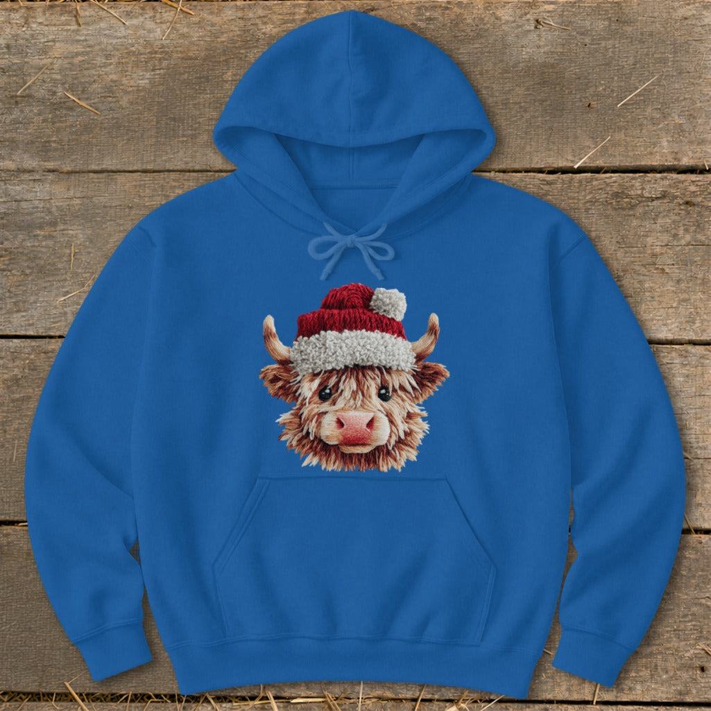 Blue hoodie with a Christmas-themed Highland cow graphic.
