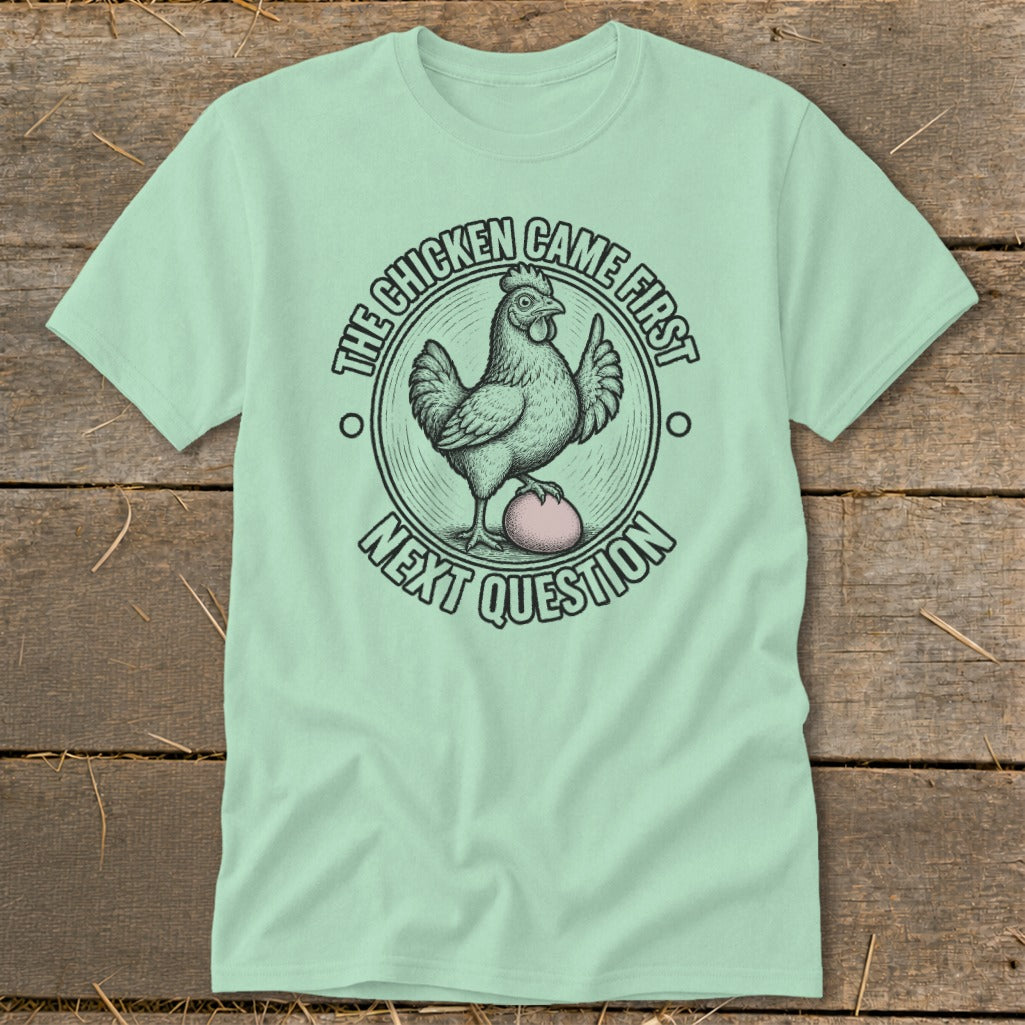 T-shirt with "The chicken came first next question" text and chicken graphic.