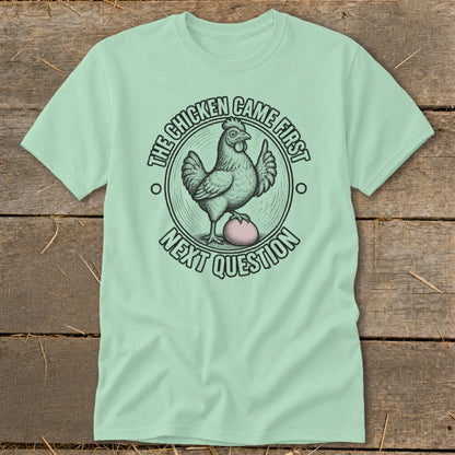 T-shirt with "The chicken came first next question" text and chicken graphic.