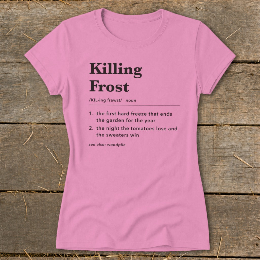Pink women's t-shirt printed with a dictionary-style definition of killing frost on a wooden background.
