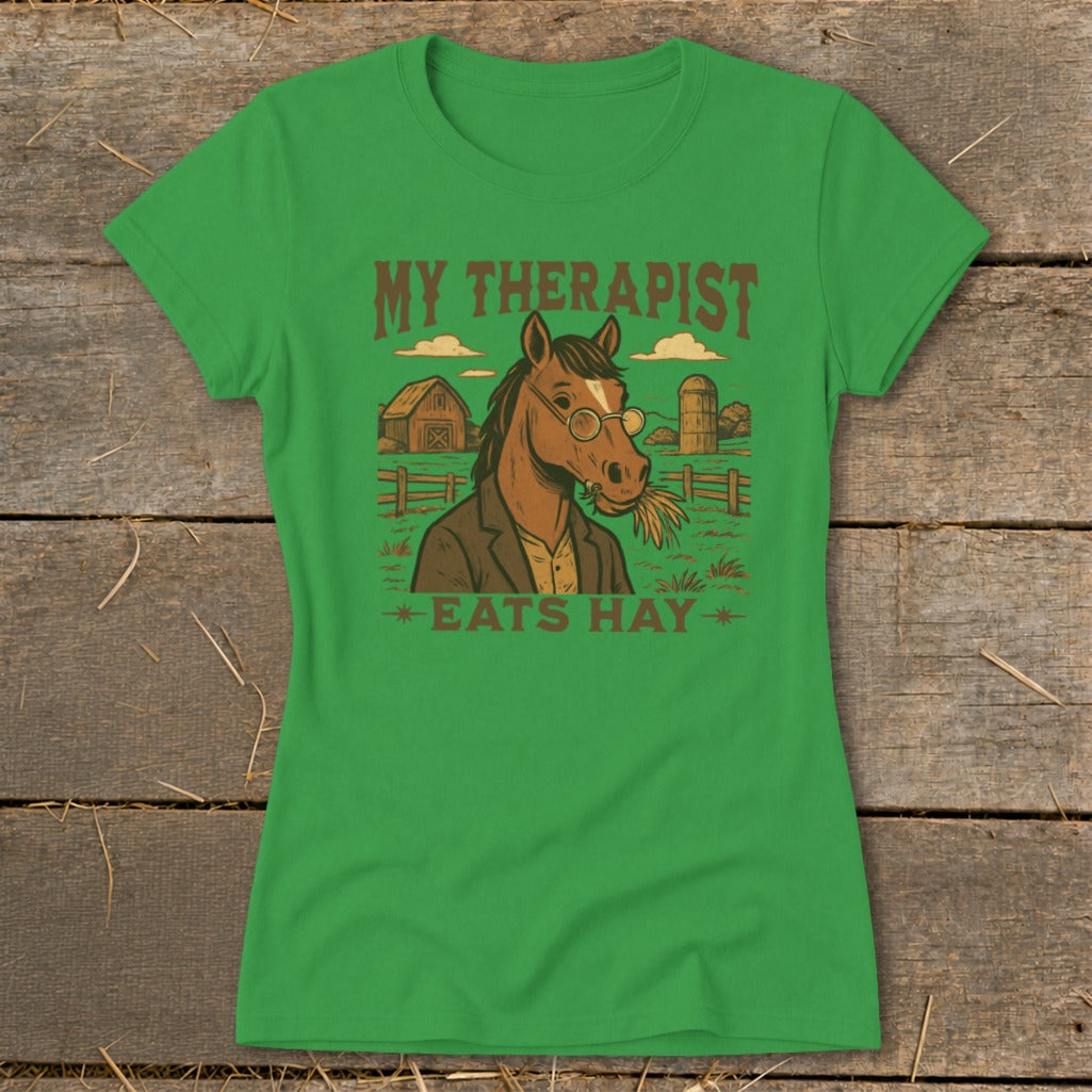 Green t-shirt with horse wearing glasses eating hay and text "MY THERAPIST EATS HAY".