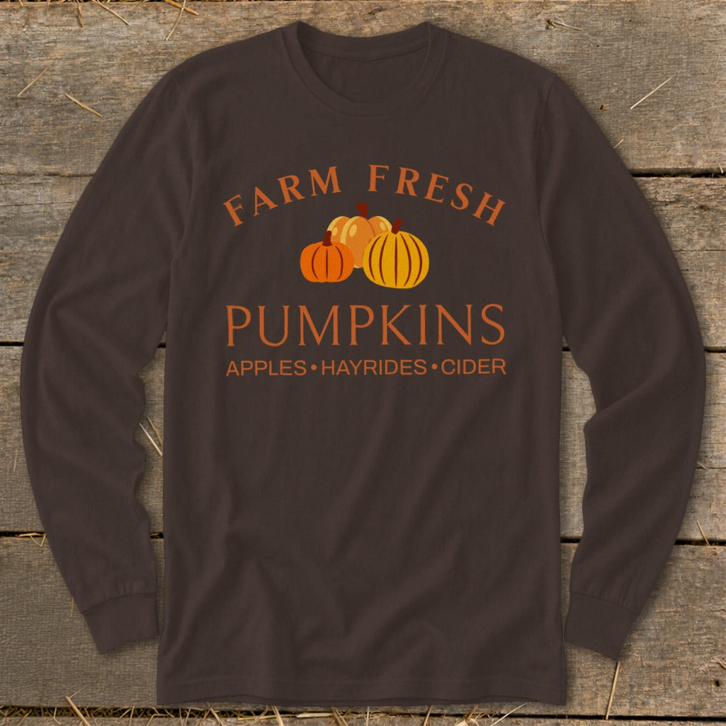 Brown long sleeve shirt with "Farm Fresh Pumpkins Apples Hayrides Cider" text and pumpkins.