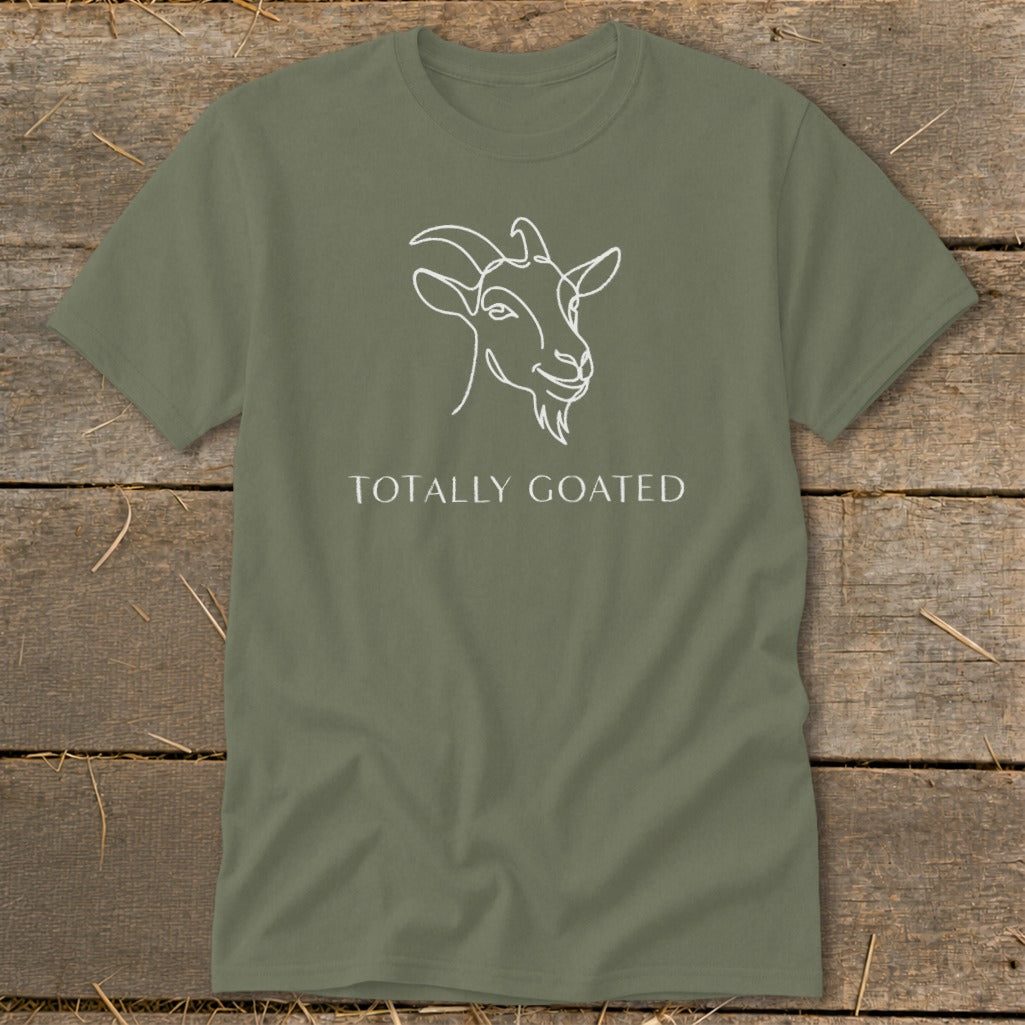Olive green t-shirt with white outline drawing of a goat and text "TOTALLY GOATED".