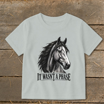 Light blue t-shirt with a charcoal sketch of a horse's head and the text "IT WASN'T A PHASE".