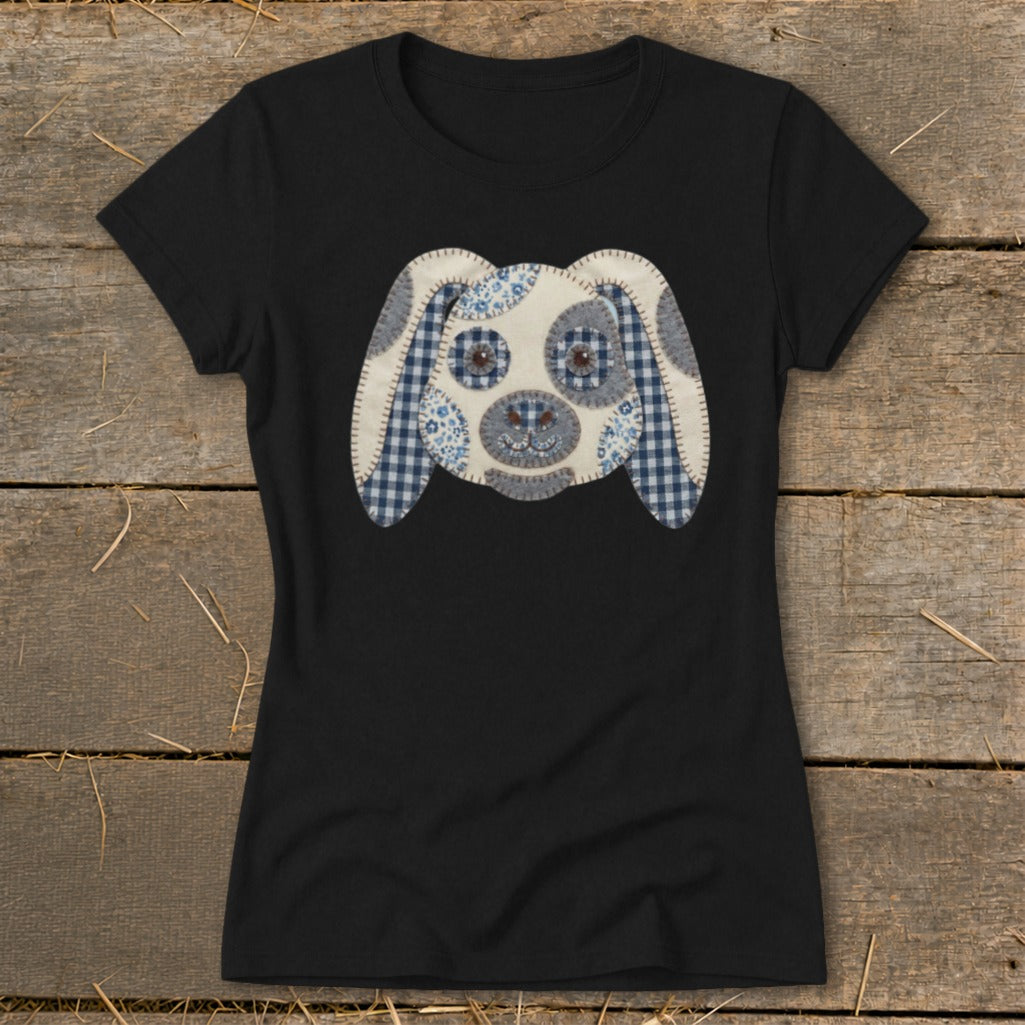 Black t-shirt with a patched fabric dog face graphic in blue and white.