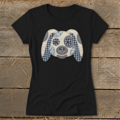 Black t-shirt with a patched fabric dog face graphic in blue and white.