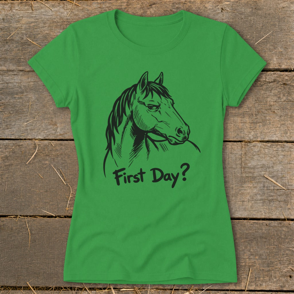 Green t-shirt with a black horse head drawing and text "First Day?".
