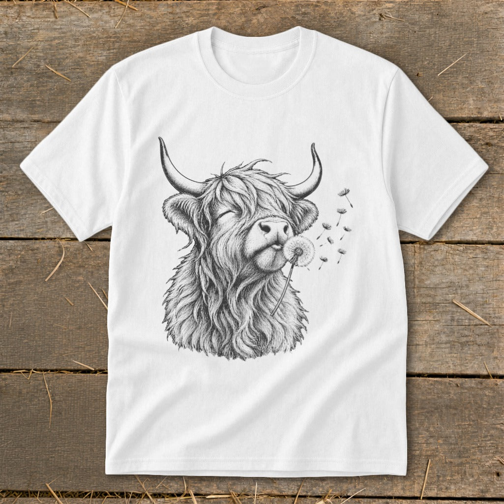 White t-shirt with a sketch of a Highland cow blowing a dandelion