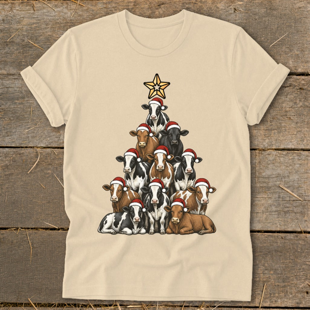 Cream t-shirt with a Christmas tree made of cows wearing Santa hats.
