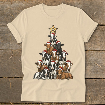 Cream t-shirt with a Christmas tree made of cows wearing Santa hats.