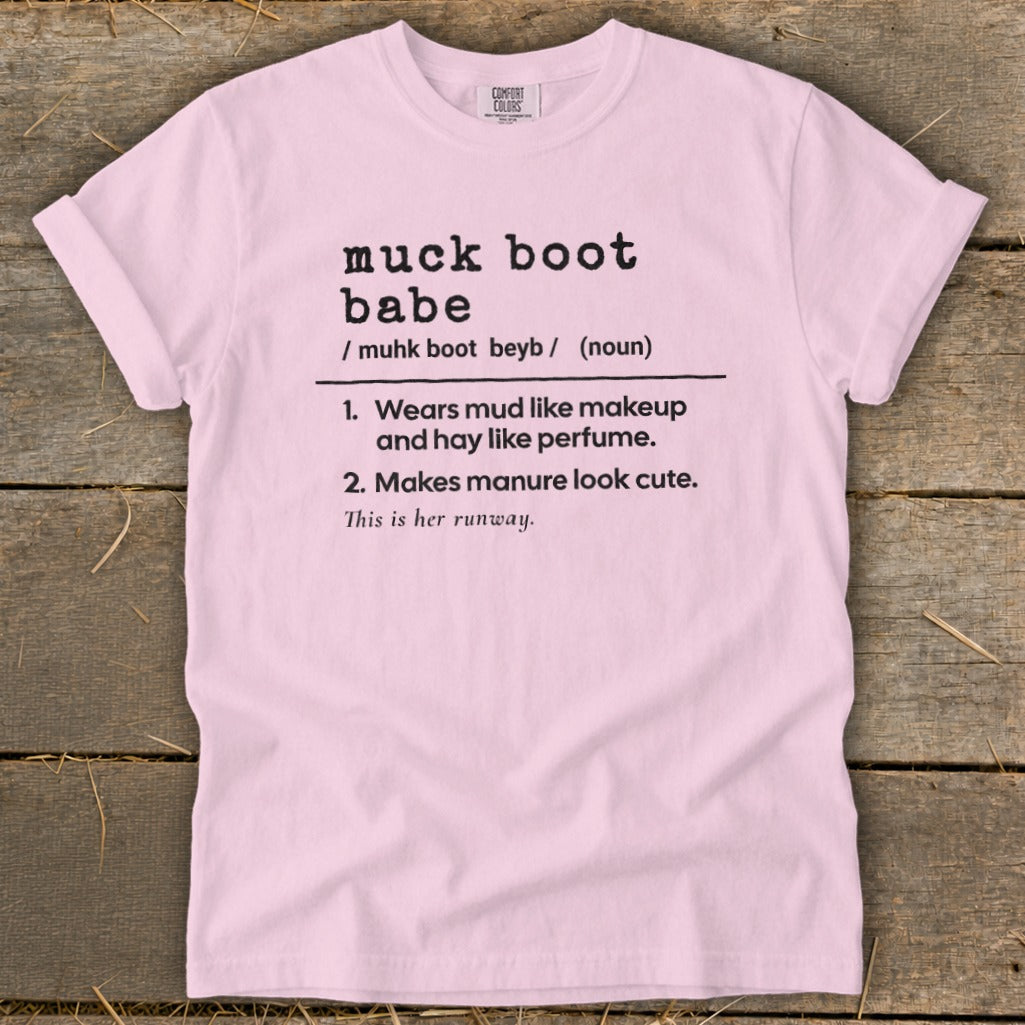 Pink t-shirt with black text defining "muck boot babe".