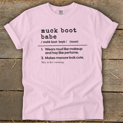 Pink t-shirt with black text defining "muck boot babe".