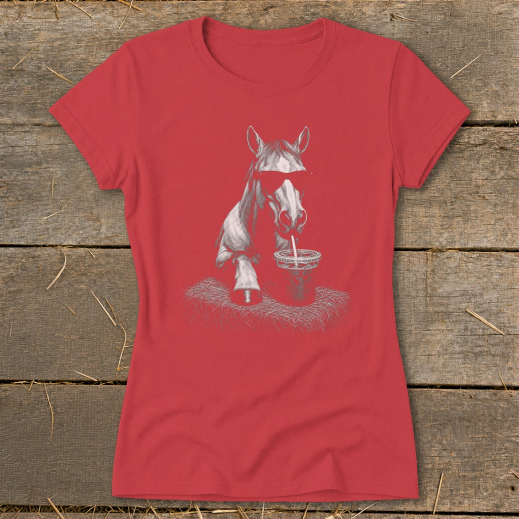 Horse wearing sunglasses drinks from a cup on a red t-shirt.