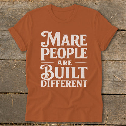 Orange t-shirt with white text: "Mare people are built different."