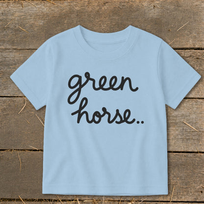 Light blue t-shirt with black cursive text "green horse..".