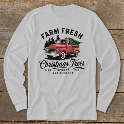 Farm fresh Christmas trees graphic on a long-sleeve shirt featuring a red pickup truck.