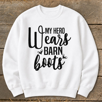 White sweatshirt with black text: "My hero wears barn boots."