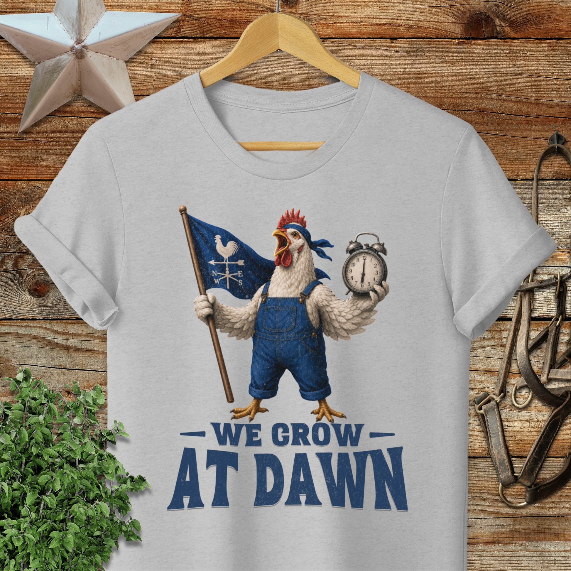 Chicken in overalls holds flag and alarm clock, "WE GROW DAWN" text.
