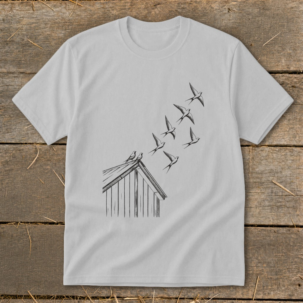 Light gray crewneck t-shirt featuring a black line drawing of birds flying from a barn roof.