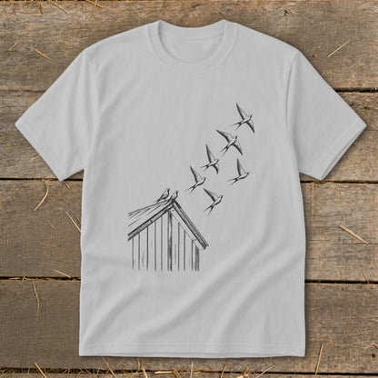 Light gray crewneck t-shirt featuring a black line drawing of birds flying from a barn roof.