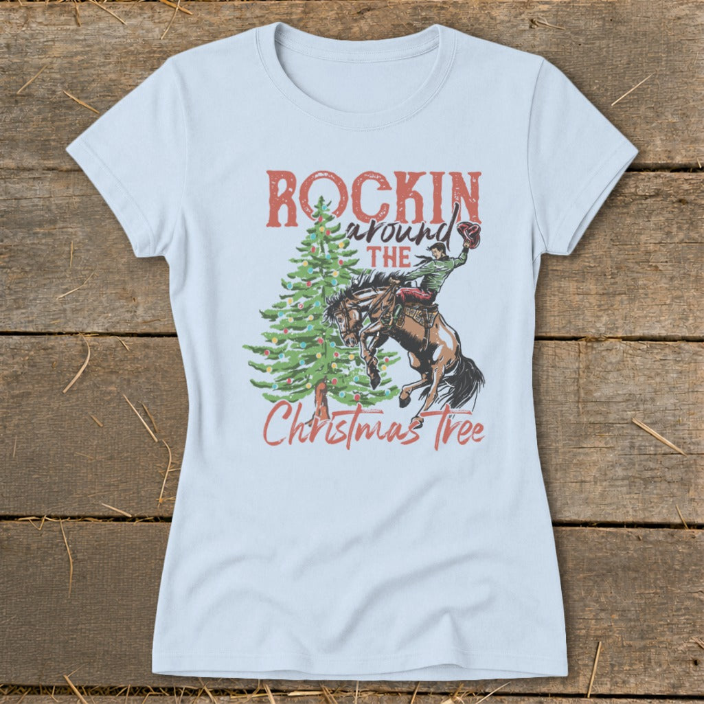 Light blue t-shirt with "Rockin Around The Christmas Tree" graphic featuring a bucking bronco.