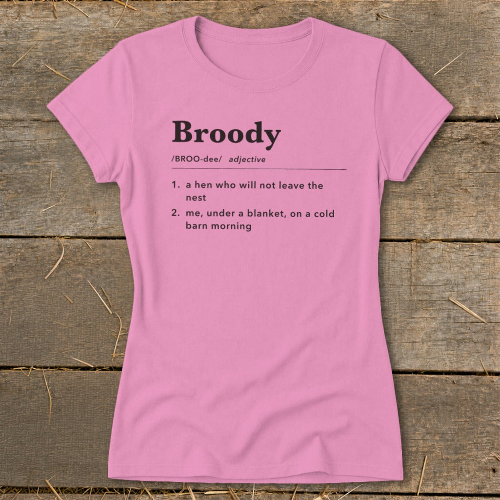 Pink t-shirt with "Broody" definition: "a hen who will not leave the nest" and "me, under a blanket, on a cold barn morning."