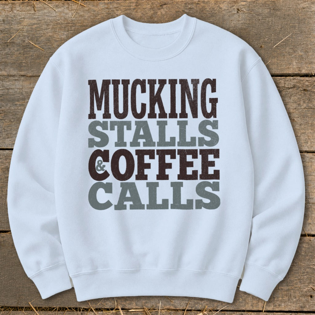 Light blue sweatshirt with "Mucking Stalls & Coffee Calls" text.
