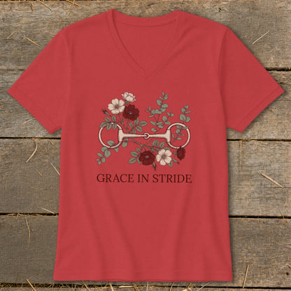 Red v-neck t-shirt with horse bit and floral design, text "GRACE IN STRIDE".