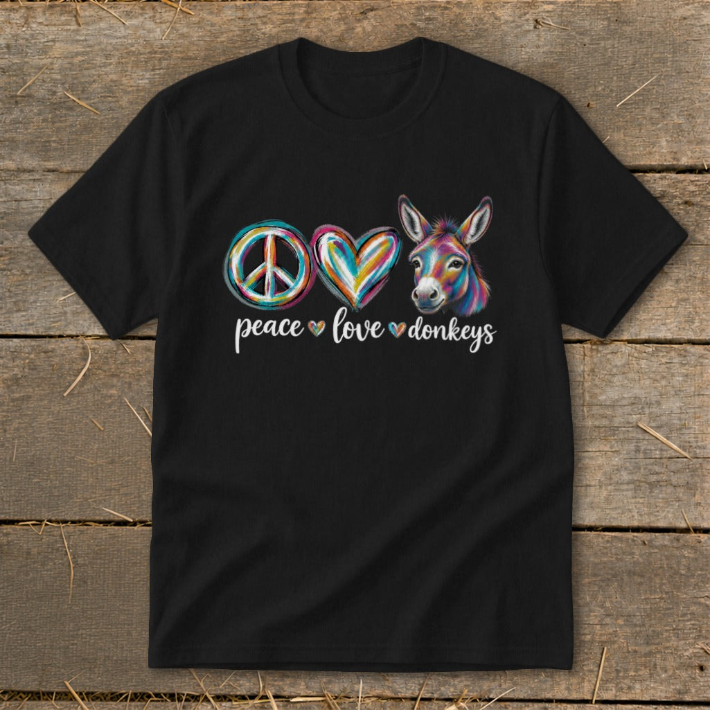 Black t-shirt with a peace sign, colorful heart, and donkey graphic above text.