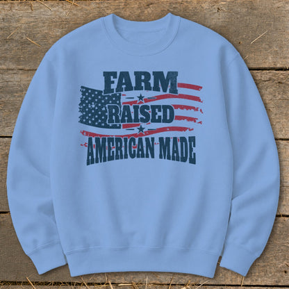 Light blue sweatshirt with "FARM RAISED AMERICAN MADE" text and distressed American flag design.