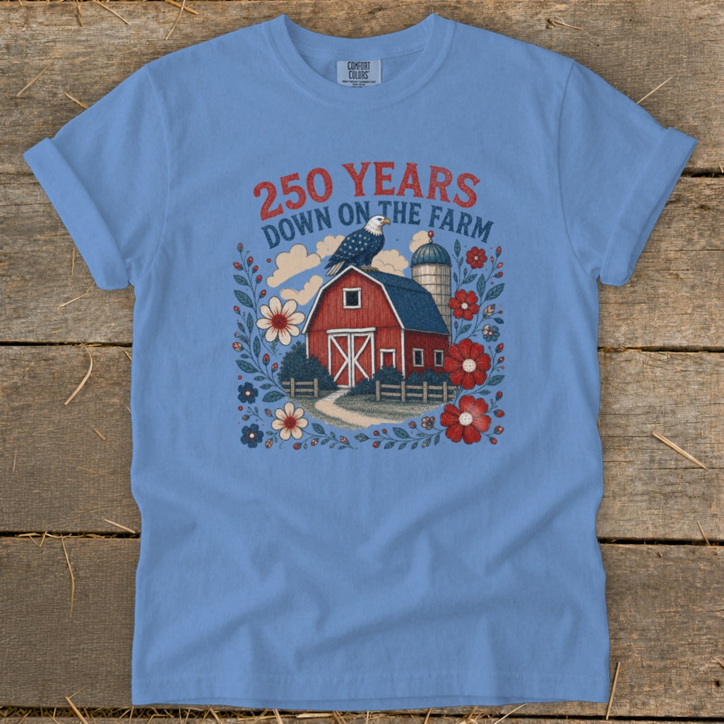 Blue t-shirt with red barn, eagle, flowers, and text "250 YEARS DOWN ON THE FARM".
