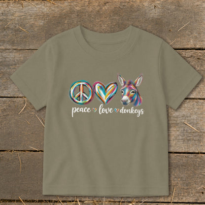 Peace, love, and donkeys graphic with a colorful donkey head on a tan t-shirt.