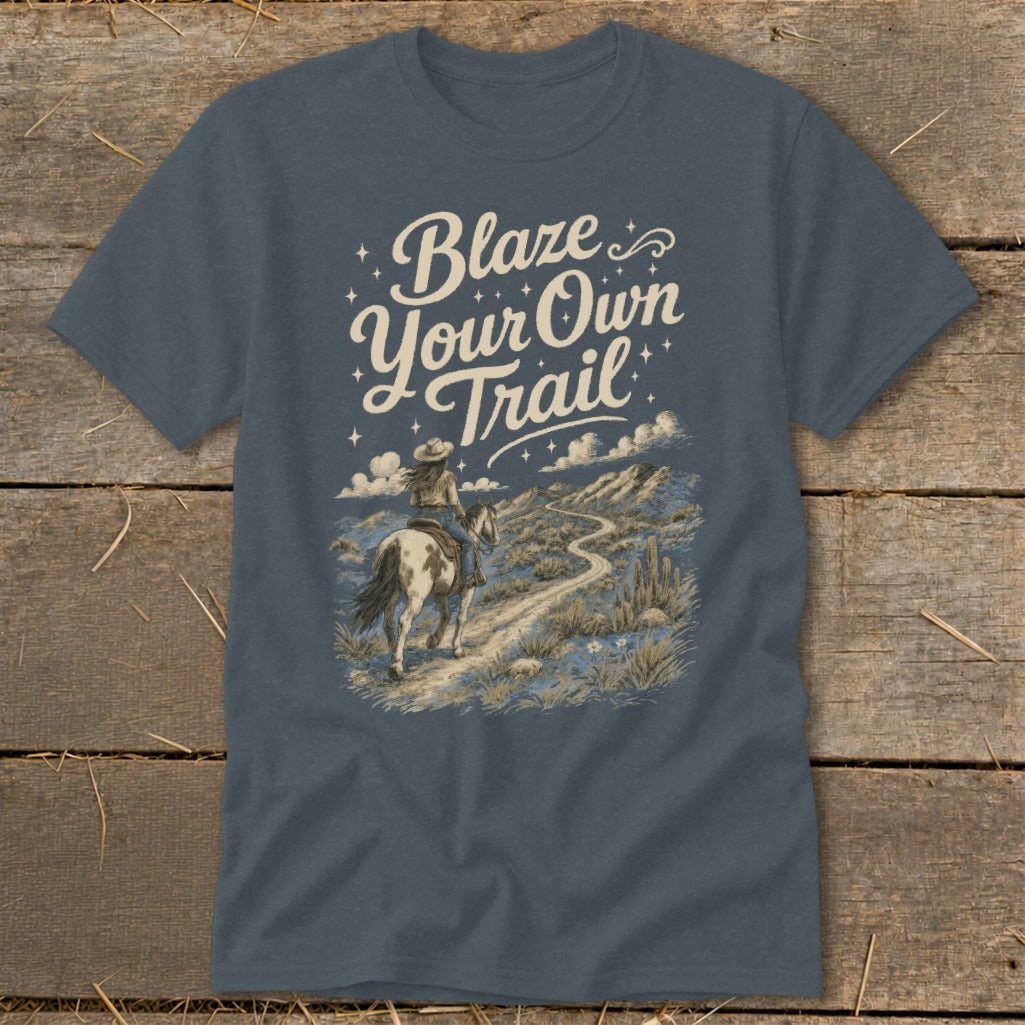 T-shirt with "Blaze Your Own Trail" text and a woman riding a horse on a desert path.