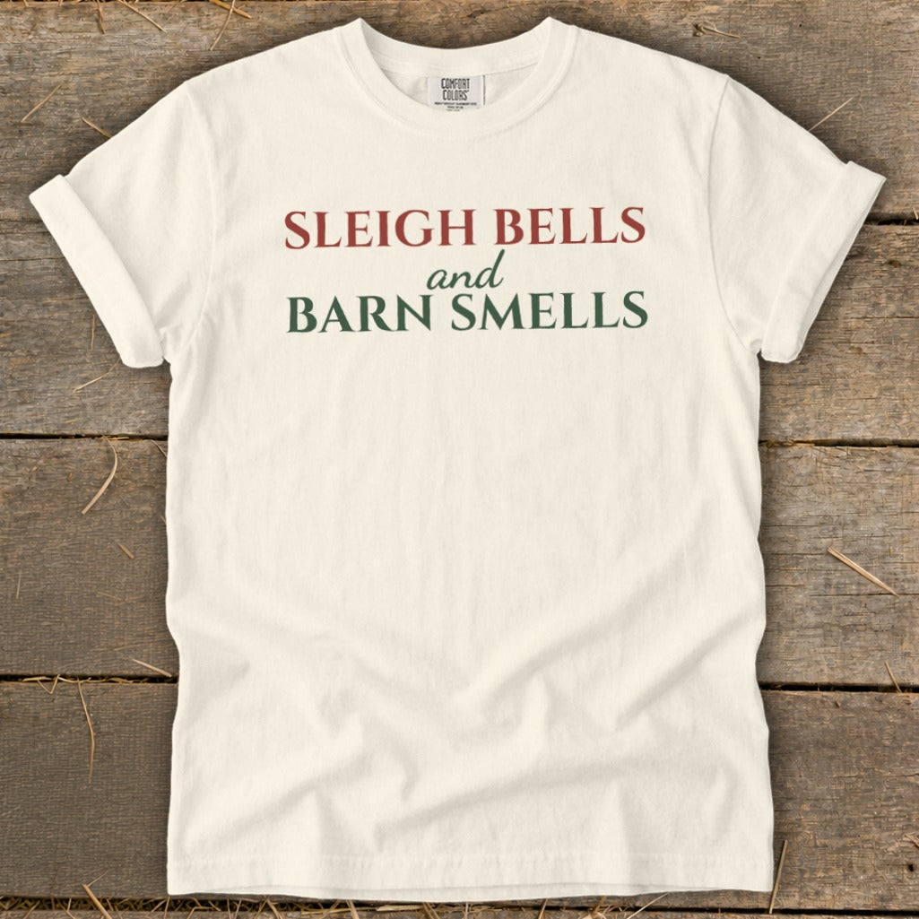 Off-white t-shirt with "Sleigh Bells and Barn Smells" text.