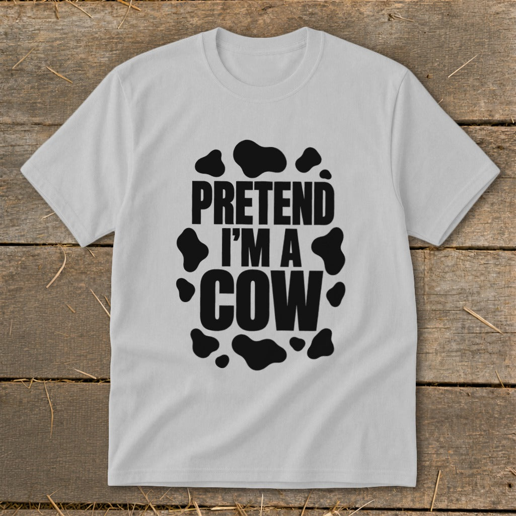 White t-shirt with black "Pretend I'm a Cow" text and cow spots.