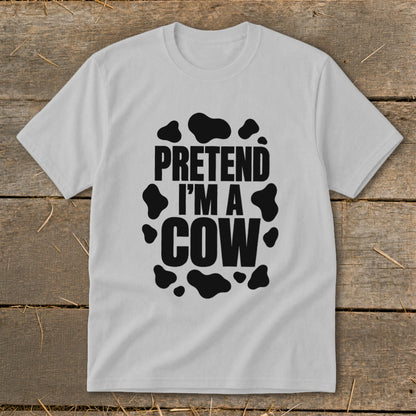White t-shirt with black "Pretend I'm a Cow" text and cow spots.