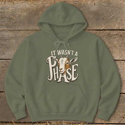 Olive green hoodie with goat illustration and text "IT WASN'T A PHASE".
